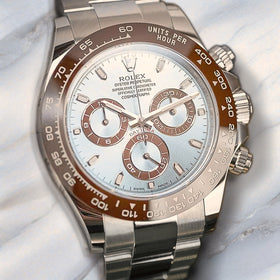 Rolex Daytona platinum luxury watch with ice blue dial on soft white marble background. Uncompromising luxury at WatchGuru NYC.