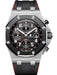 Audemars Piguet Royal Oak Offshore 42mm chronograph in stainless steel with a black “Méga Tapisserie” dial and black-red rubber strap.


