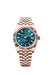 "Rolex Sky-Dweller 42mm in 18 kt Everose Gold with blue-green dial and Jubilee bracelet."